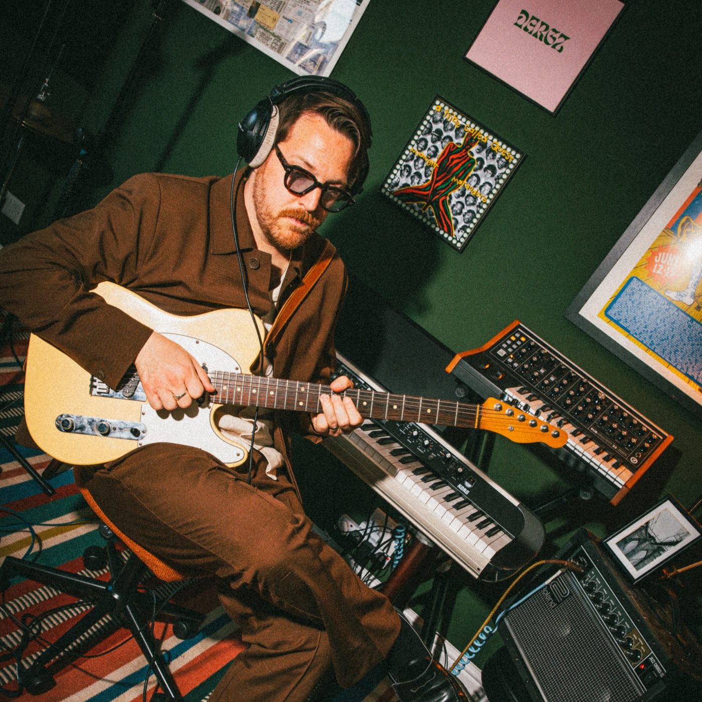 Dargz playing guitar in the studio