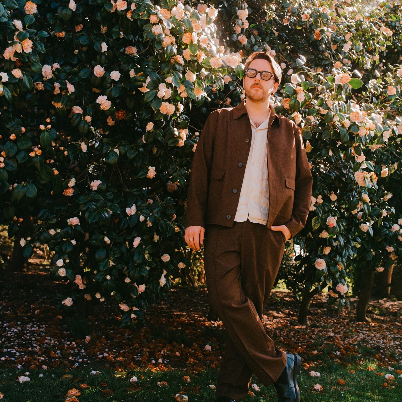 Dargz standing among camellia blossom