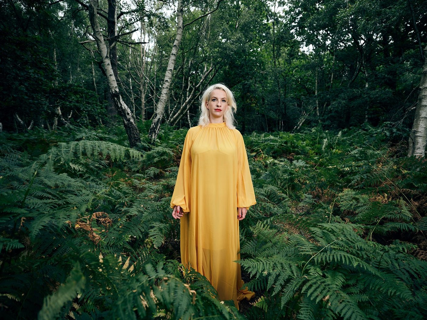 Izo FitzRoy in a woodland clearing