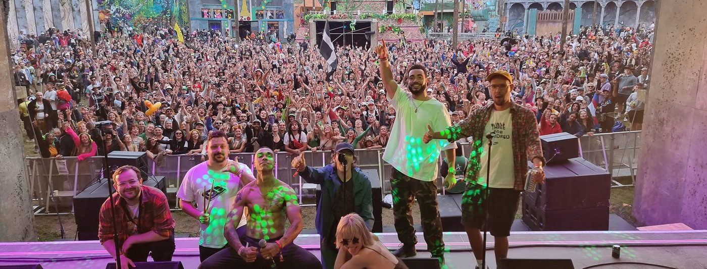 The Mouse Outfit on stage in front of a huge festival crowd