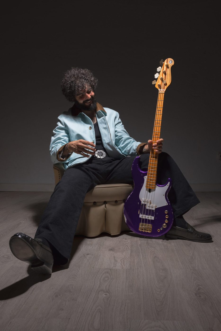 Vincen García seated with his bass